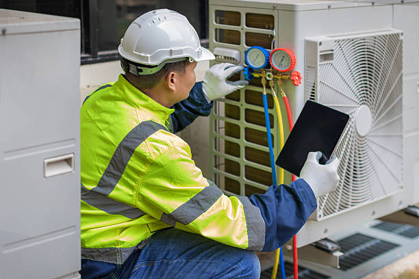 Professional Emergency Ac Repair technician working in Moundville, AL